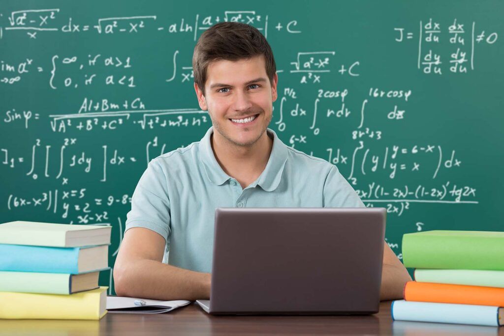 Man Using Laptop While Studying